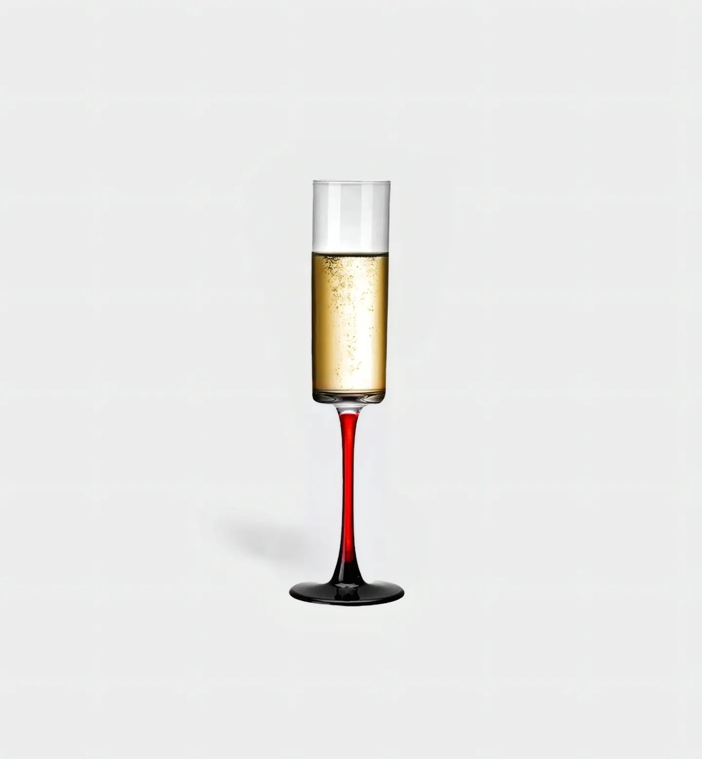 Ce verre à champagne 100 ml au design minimaliste et pied noir ou rouge sublime les bulles avec élégance, parfait pour des réceptions modernes et raffinées.